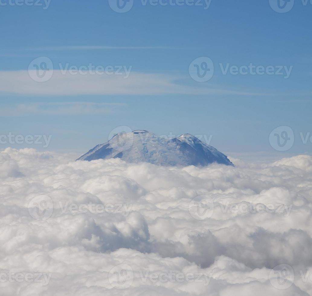 Mountain above the clouds photo