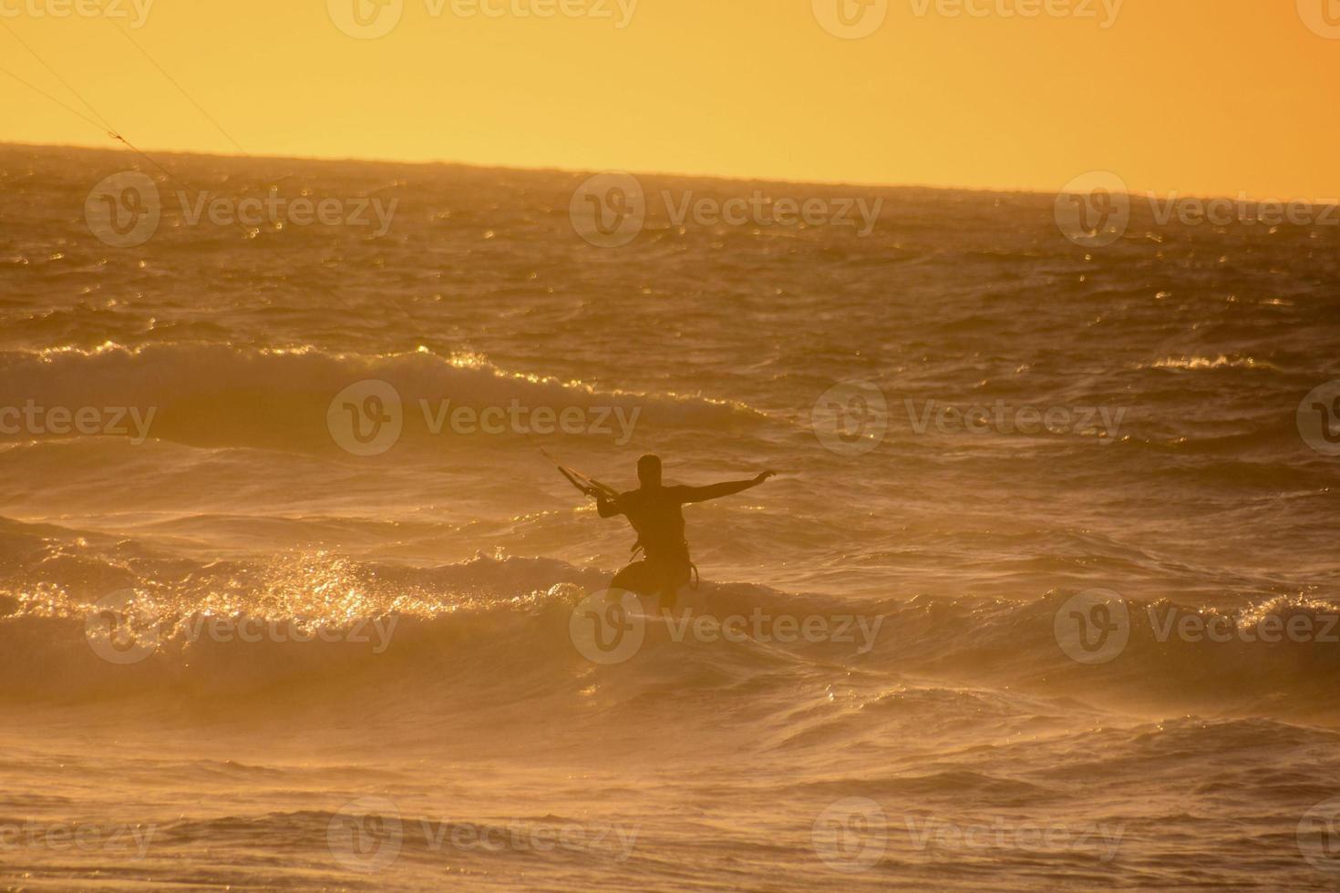 Kitesurfer at sunset photo