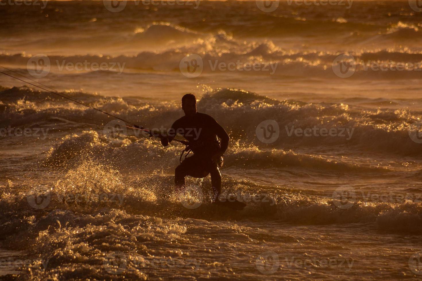 Kitesurfer at sunset photo