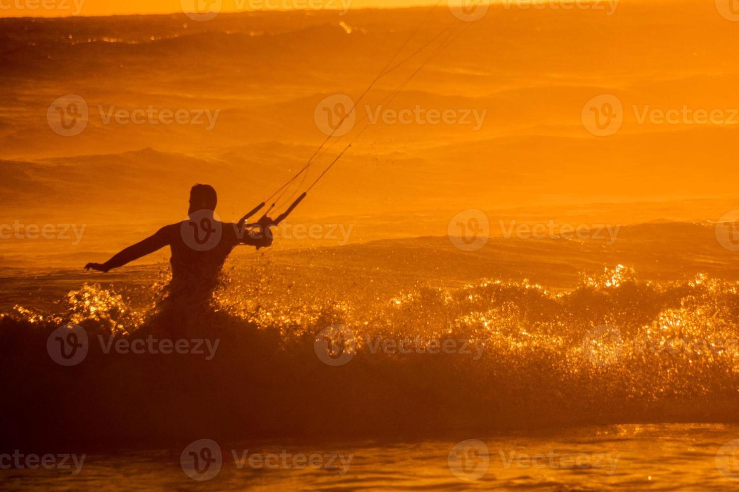 Kitesurfer at sunset photo