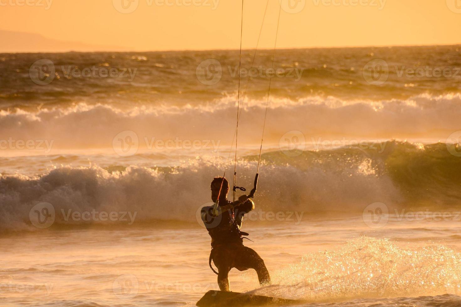 Kitesurfer at sunset photo