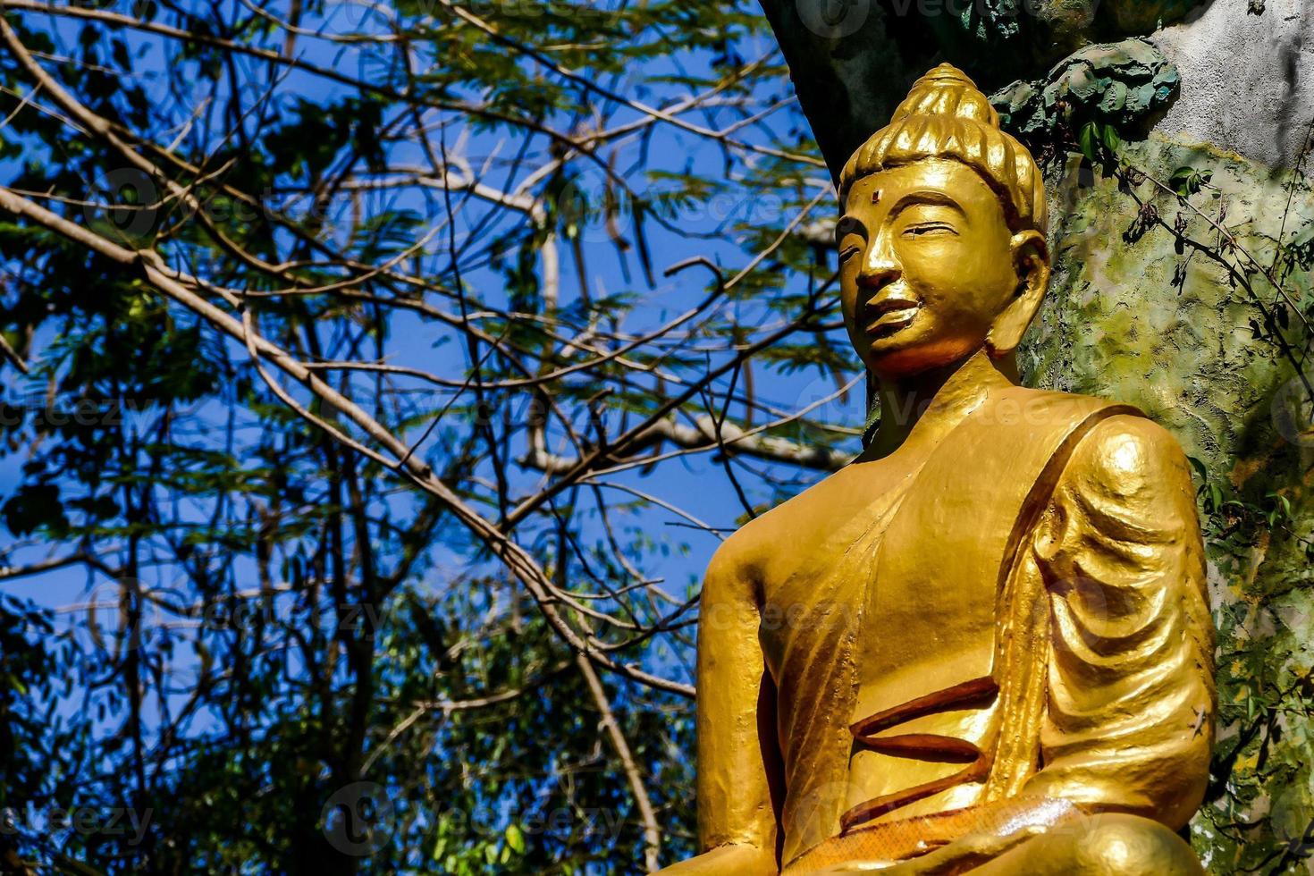 Golden Buddhist statue 20985292 Stock Photo at Vecteezy