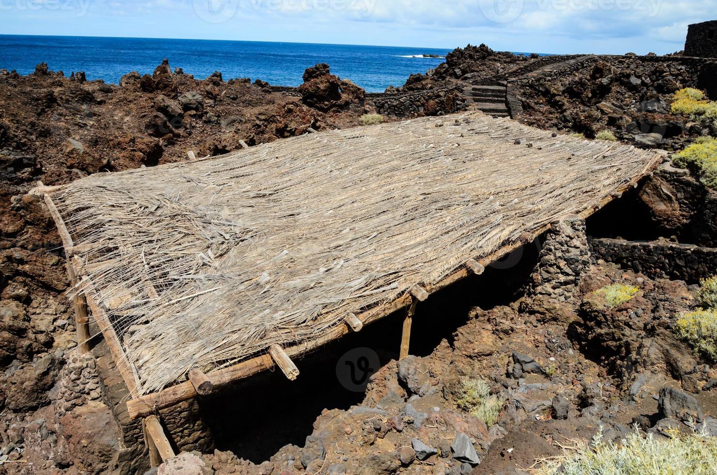Old wood and stone hut photo