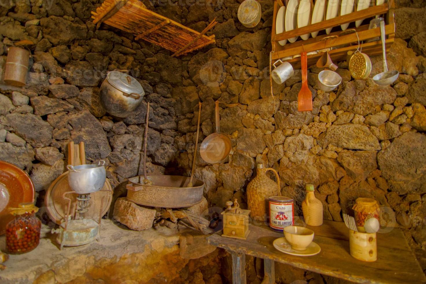 Kitchen area with stone walls photo