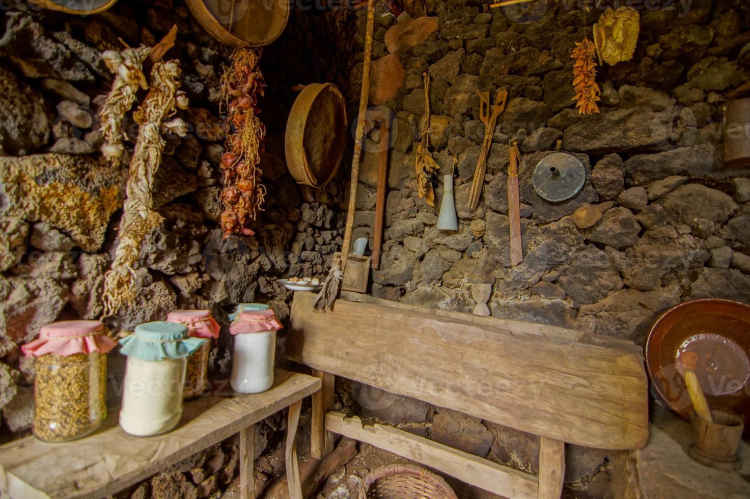 Kitchen area with stone walls photo