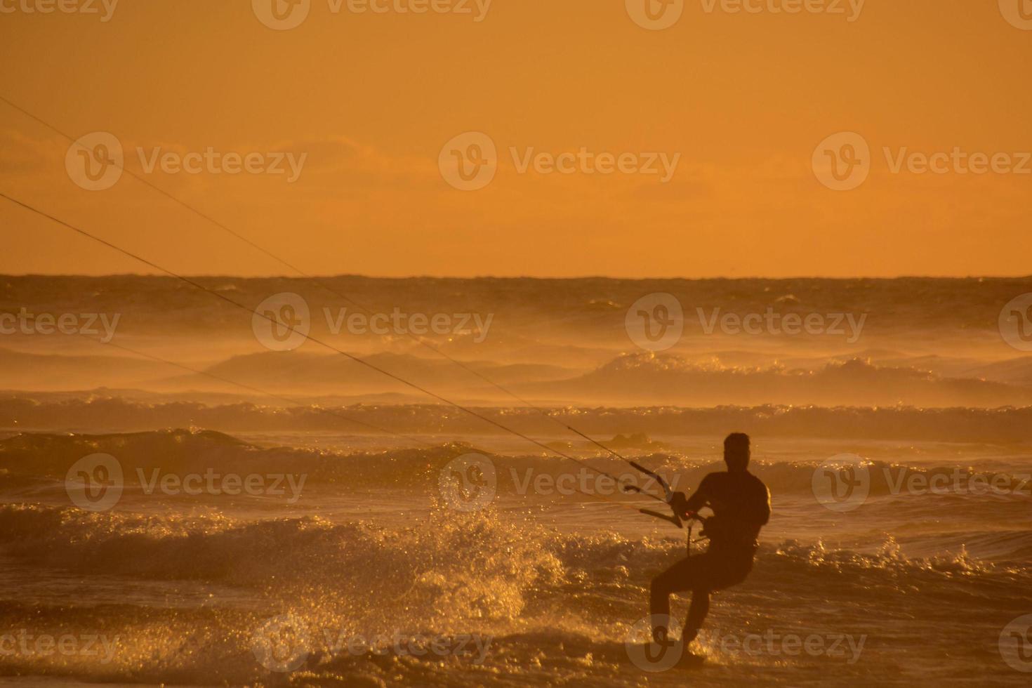 Kitesurfer at sunset photo