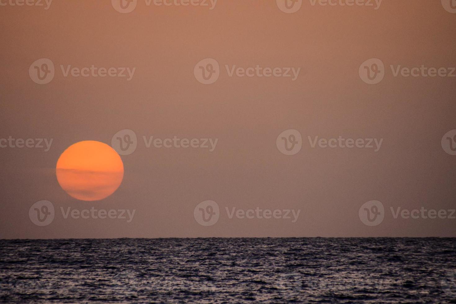 Sunset over the sea photo