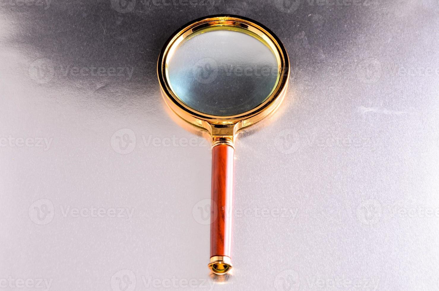 Gold magnifying glass 20987554 Stock Photo at Vecteezy