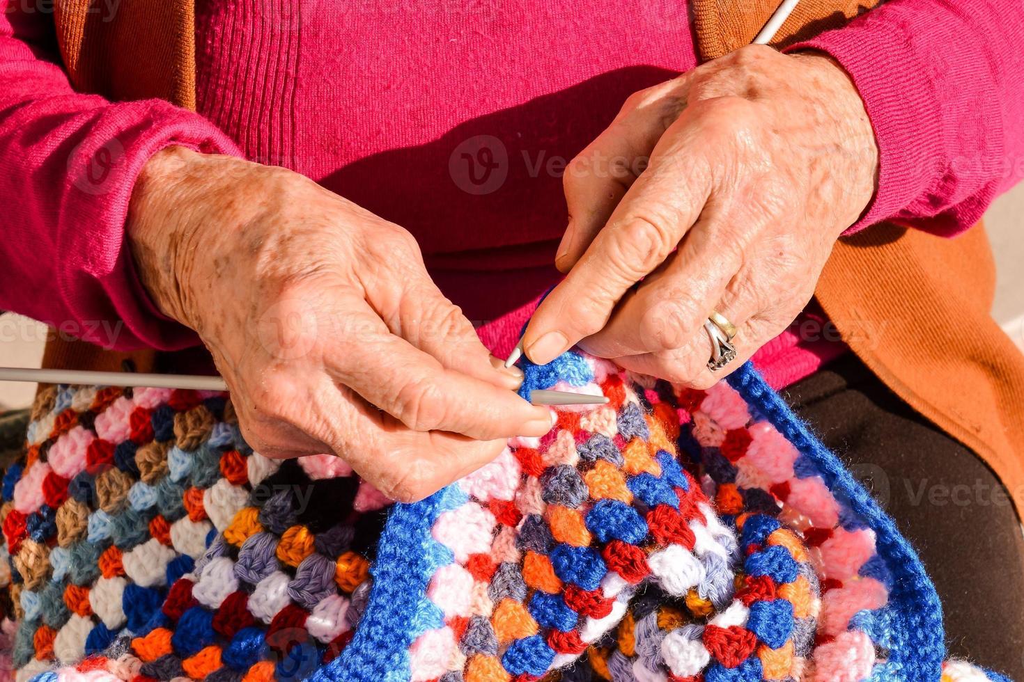 Woman knitting fabric photo