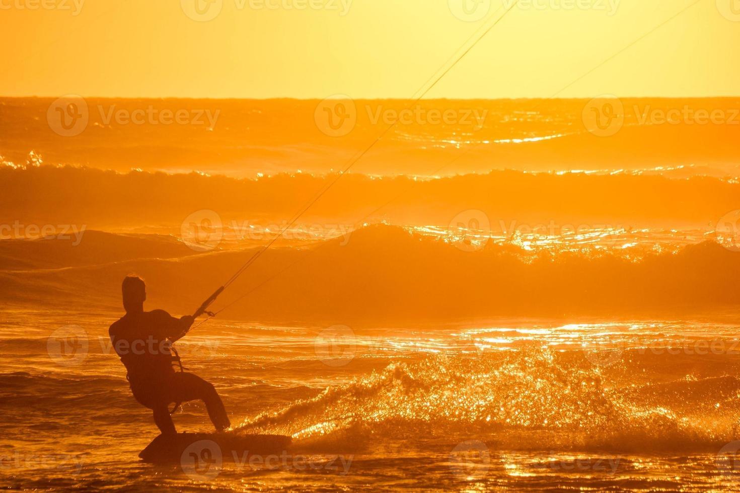 Kitesurfer at sunset photo