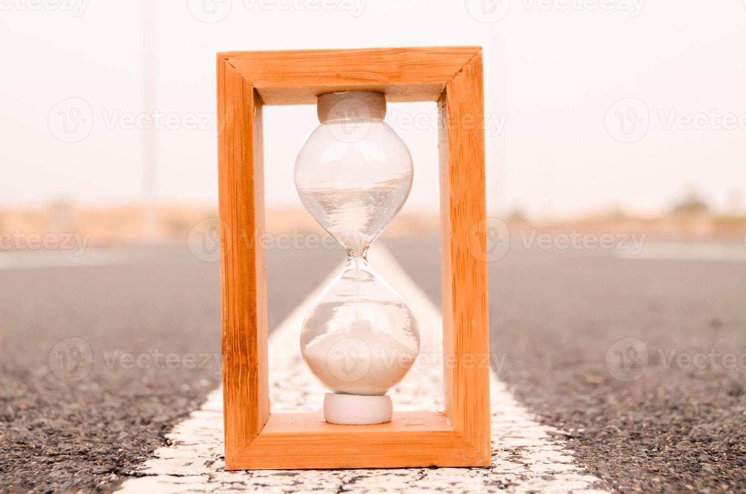 Hourglass on the road photo