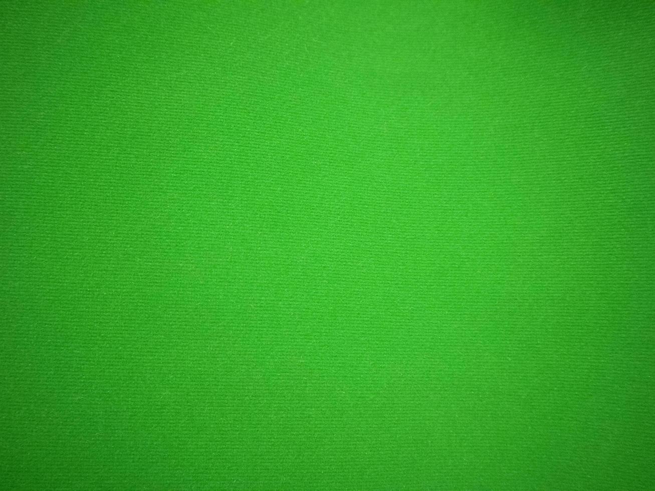 green velvet fabric texture used as background. Empty green fabric background of soft and smooth textile material. There is space for text.. photo