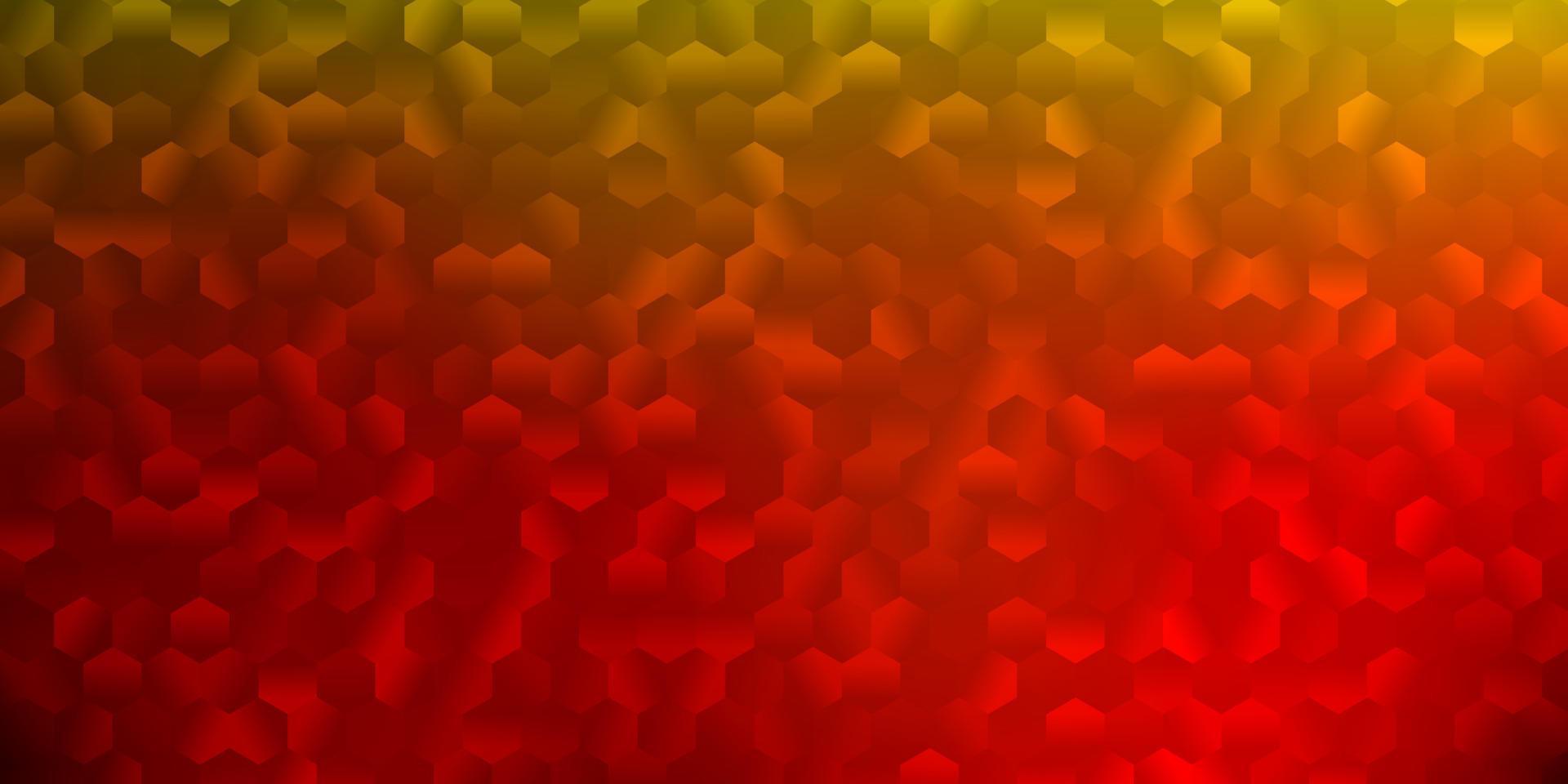 Light red, yellow vector backdrop with a batch of hexagons.