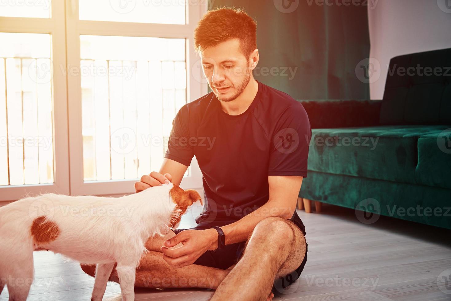 Man doing sport exercise with his dog photo