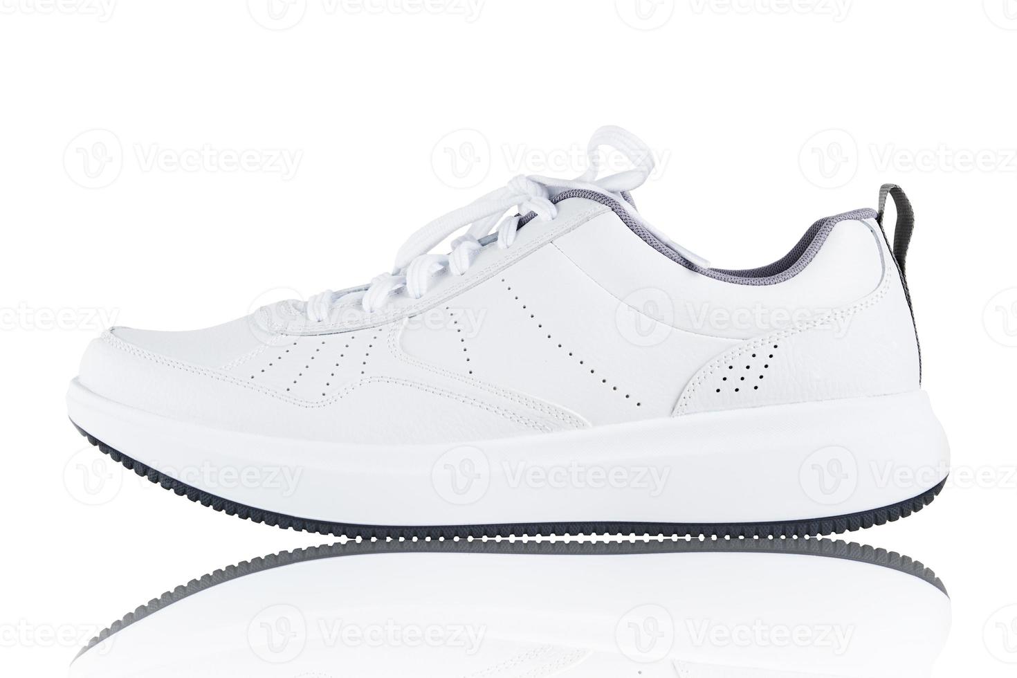 Sneaker isolated on white background. New unbranded sport shoe photo