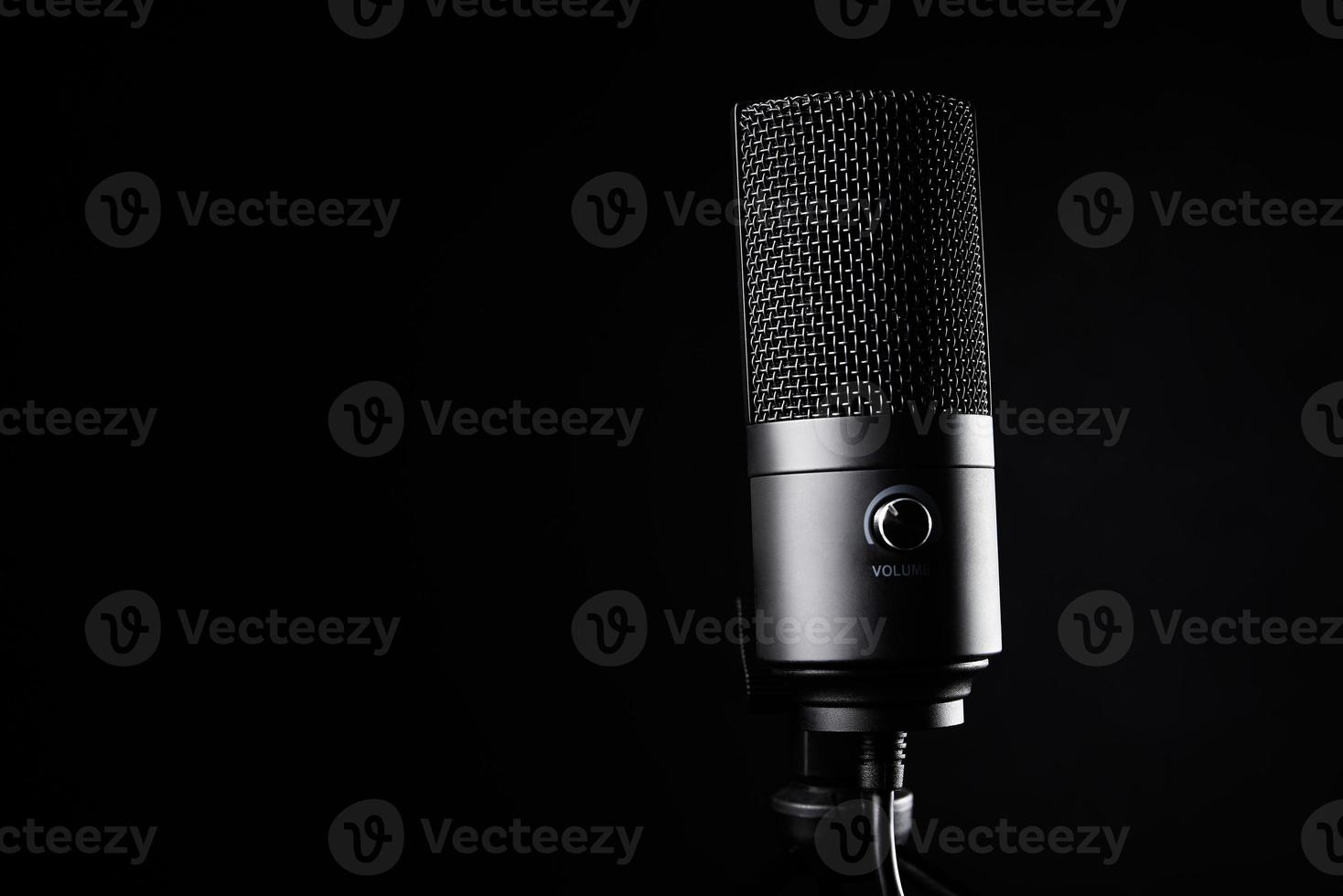 Studio microphone on dark background photo