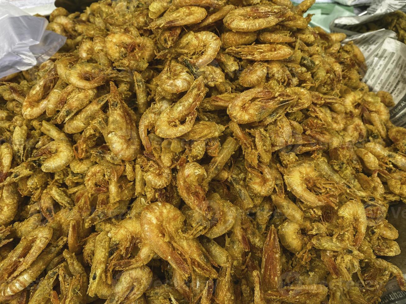 Fried meat fish at traditional market photo