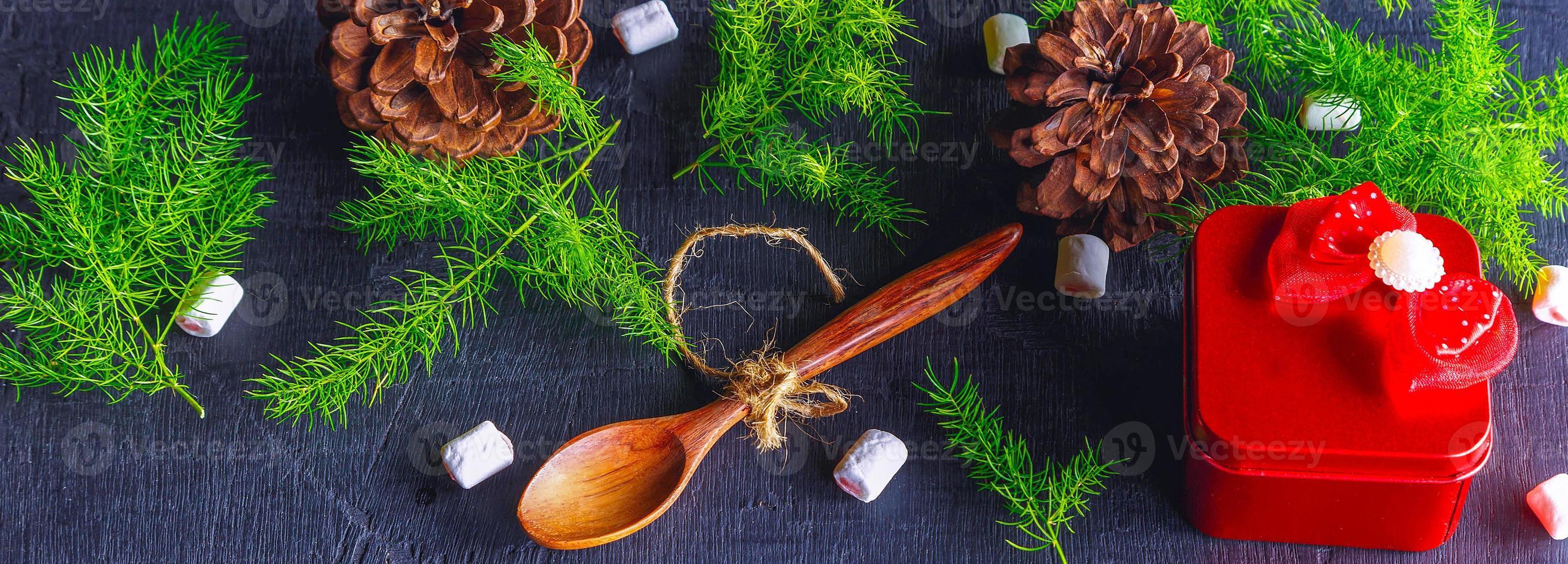 Wooden spoon and pine tree background Christmas background concept photo