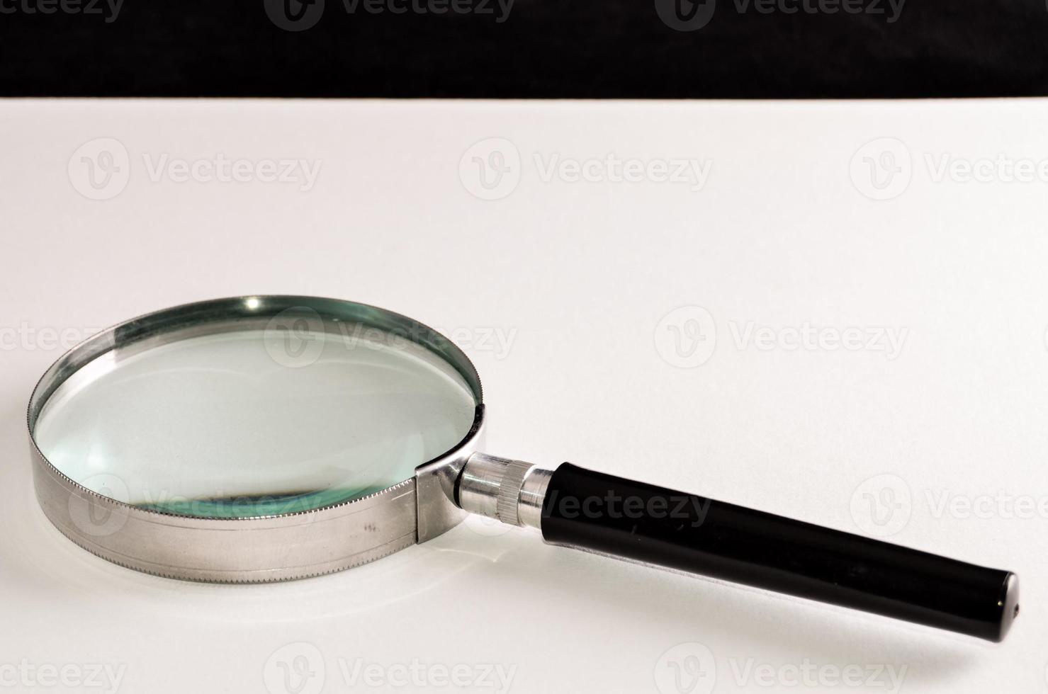 Silver magnifying glass photo