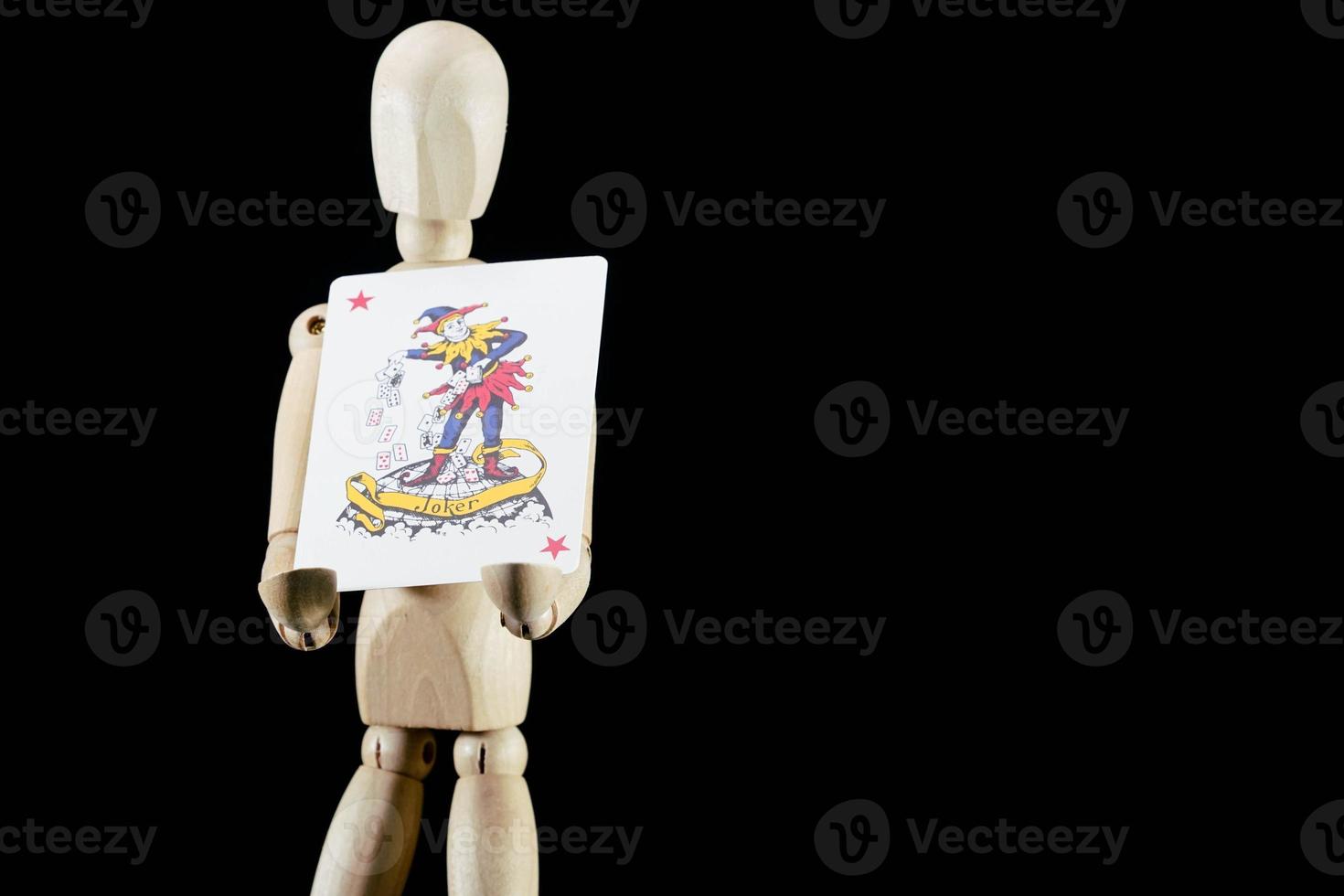 Wooden mannequin on dark background photo