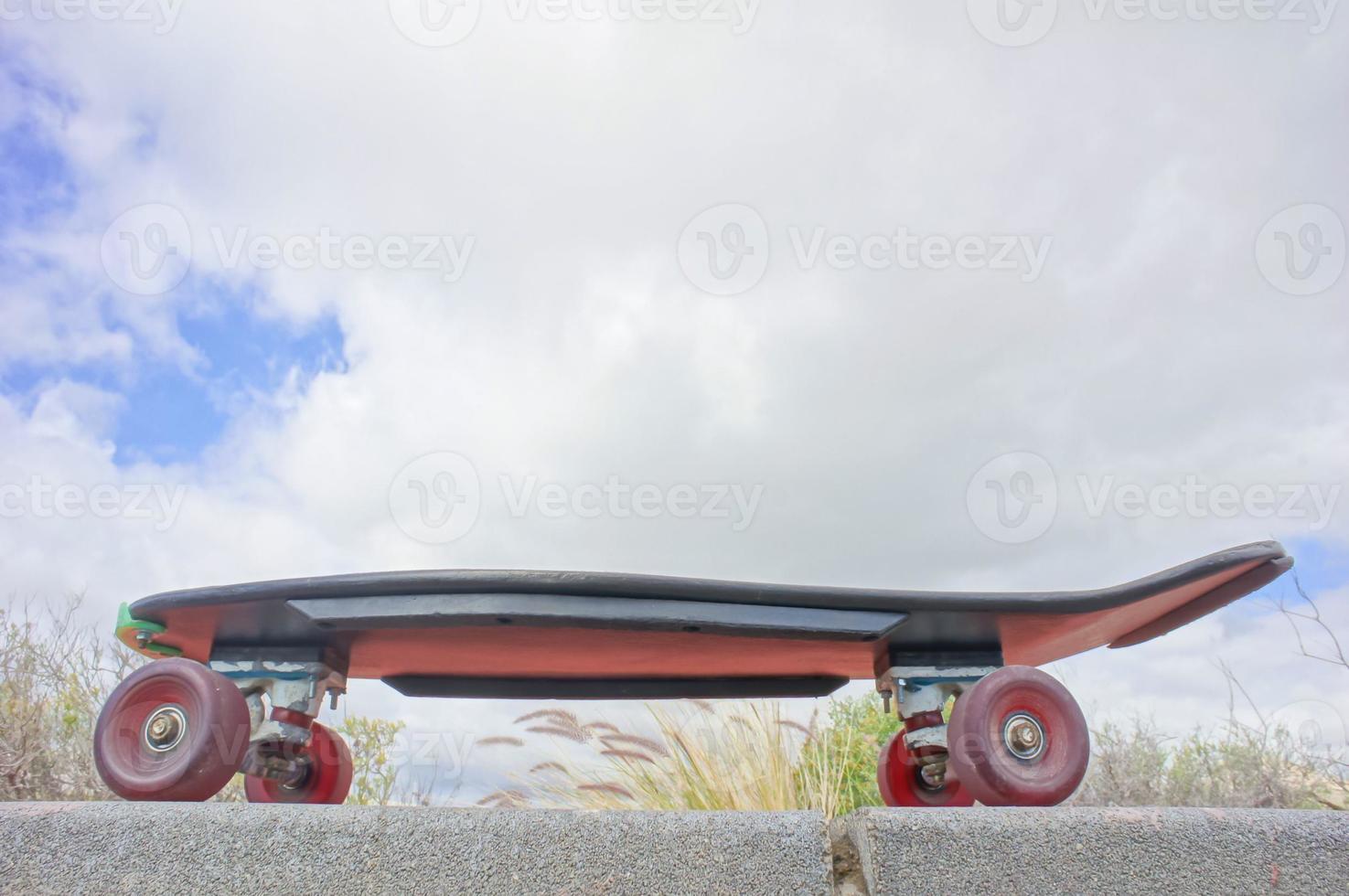 Skateboard on the sidewalk photo