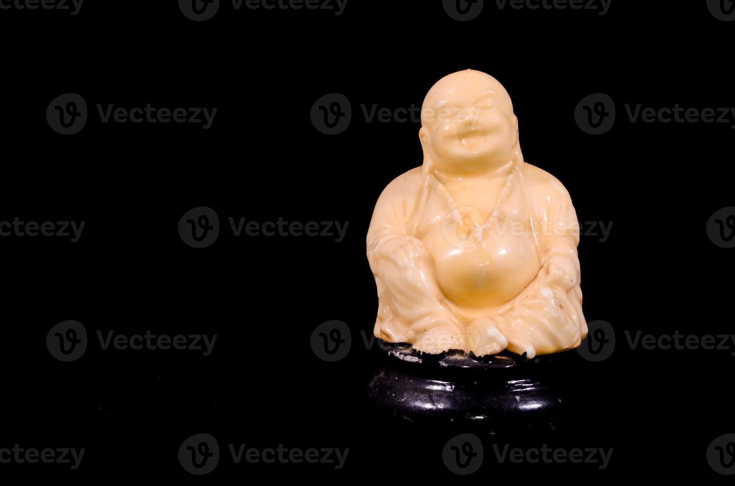Buddha statue on dark background photo