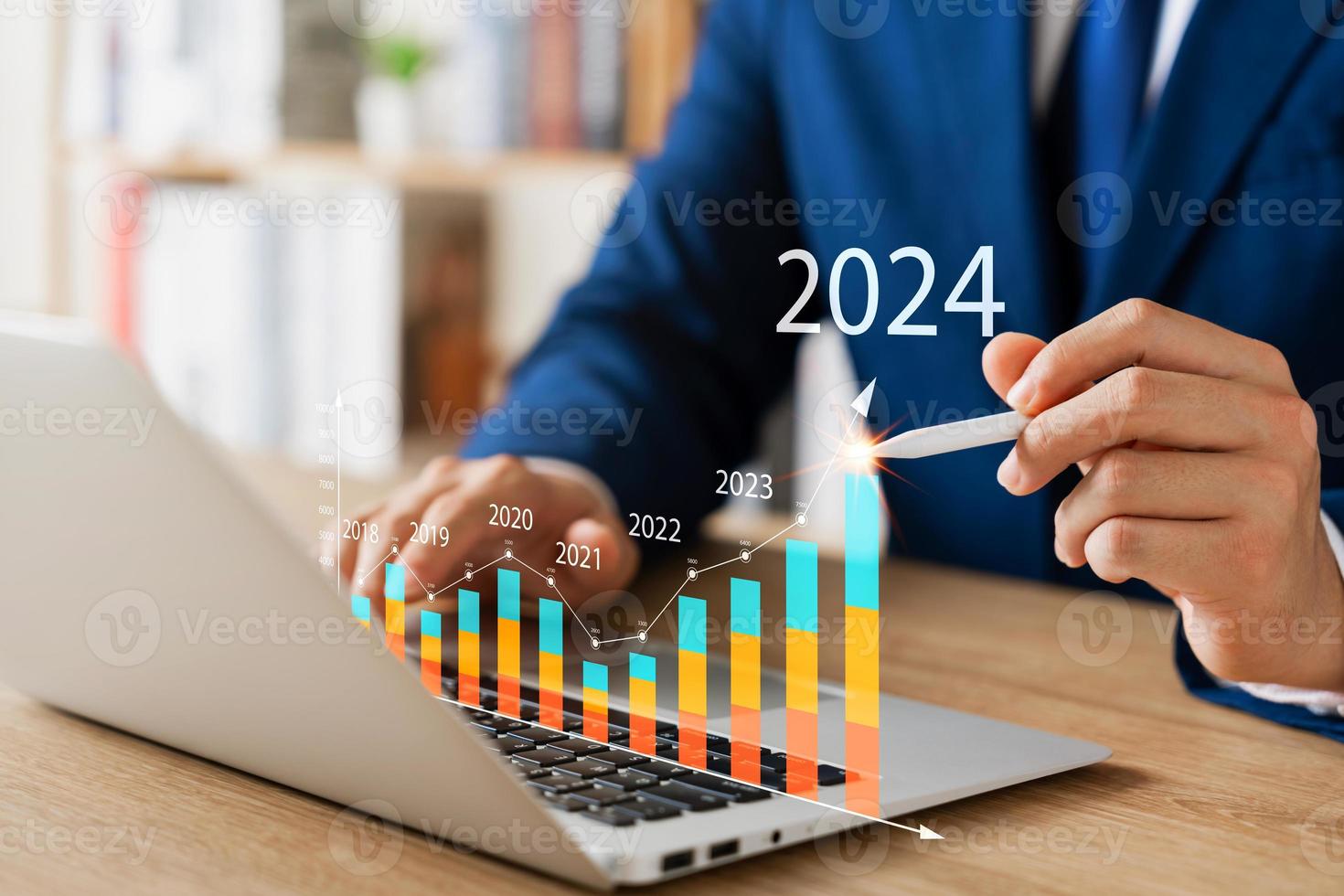 Businessman analyzes profitability of working companies with digital augmented reality graphics, positive indicators in 2024, businessman calculates financial data for long-term investments. photo