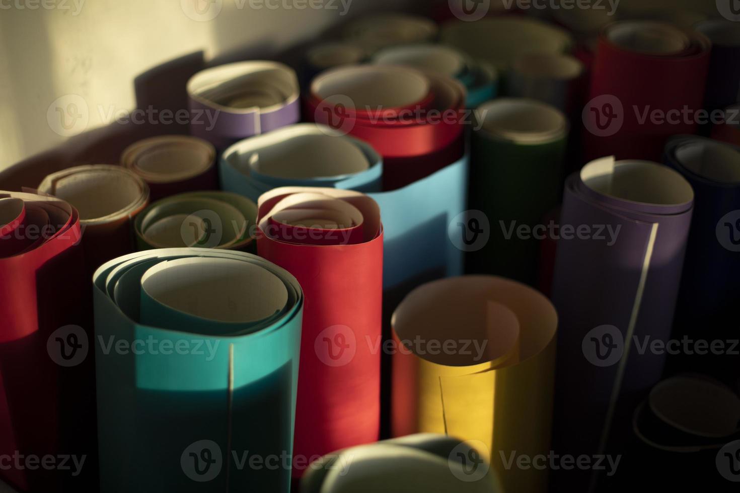 Rolls of colored paper. Self-adhesive film in rolls. Creative material. photo