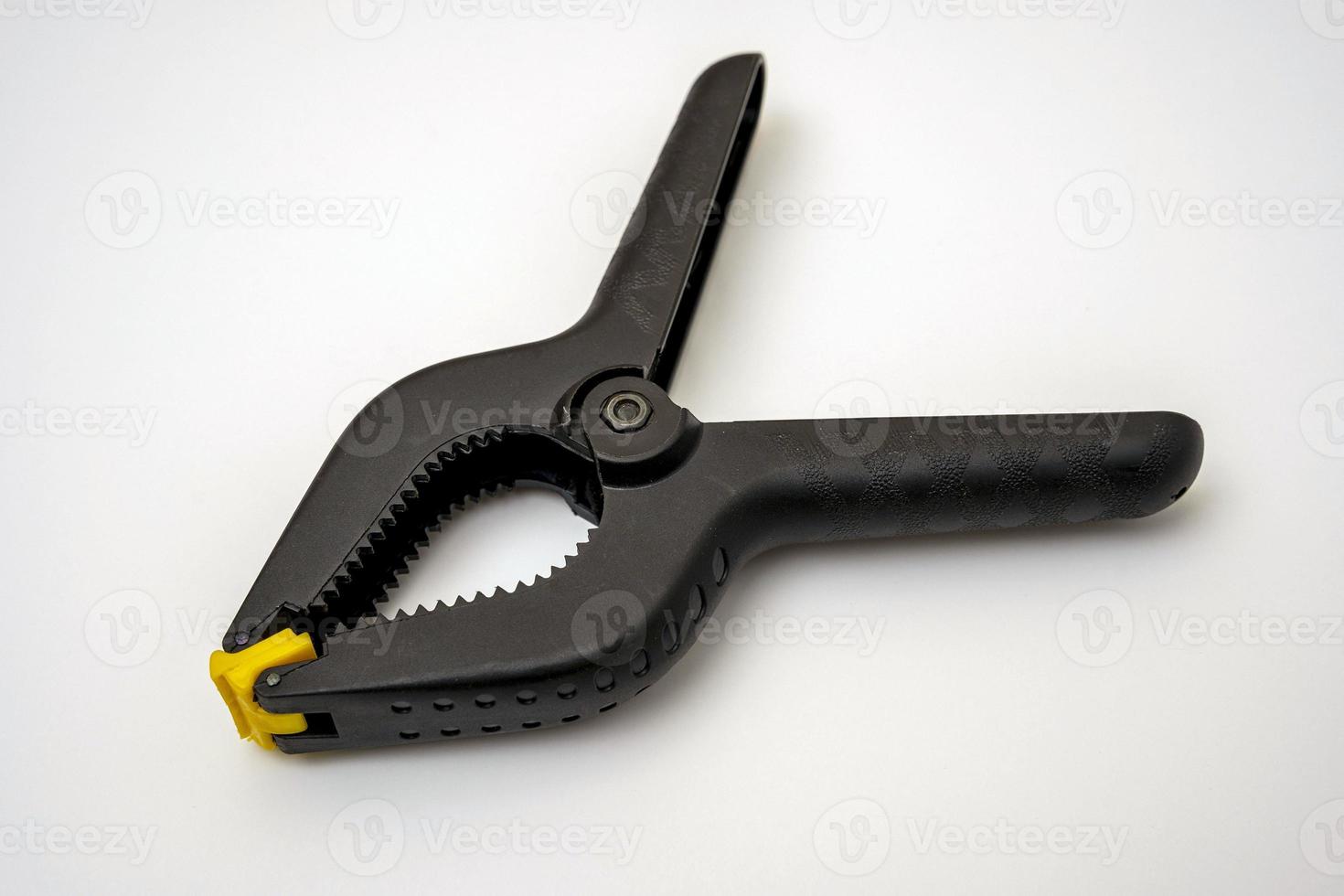 Manual spring clamp, Black plastic spring clamp. photo