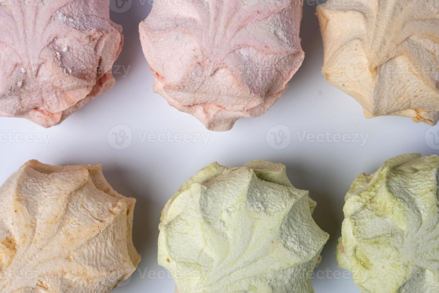 delicious sweet marshmallows on a white background, colored sweet dessert marshmallows on a white background. photo