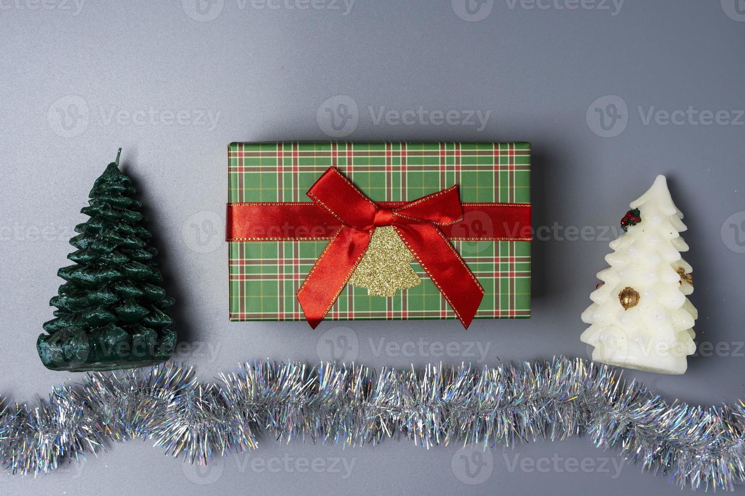 A gift for Christmas and New Year, Merry Christmas And Happy New Year, candles in the form of Christmas trees photo