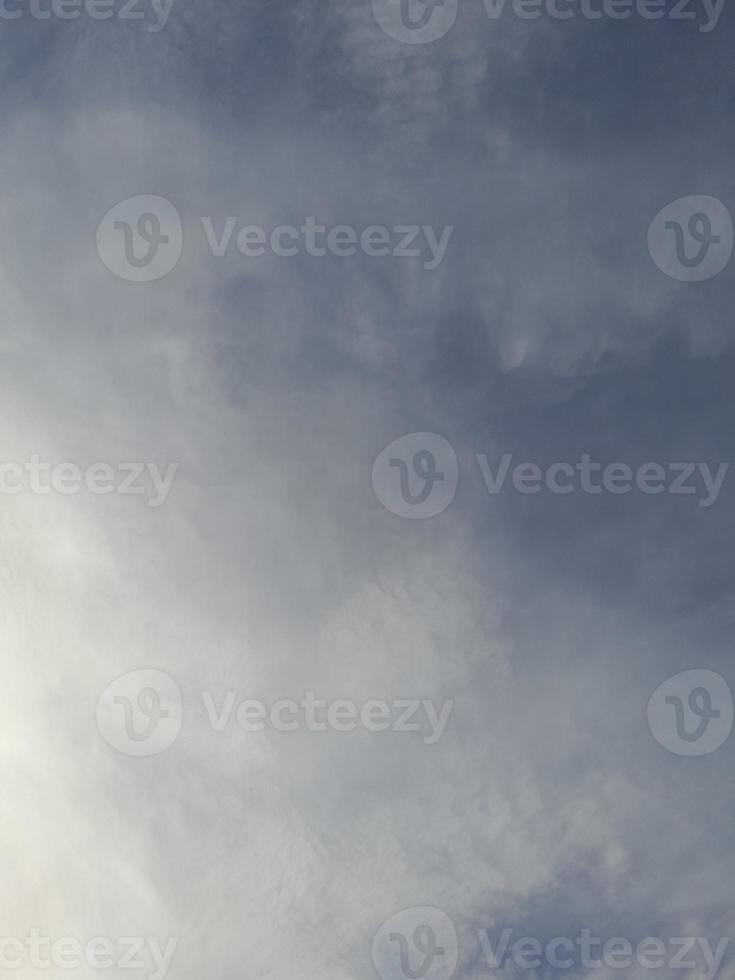 Beautiful white clouds on deep blue sky background. Large bright soft fluffy clouds are cover the entire blue sky. photo