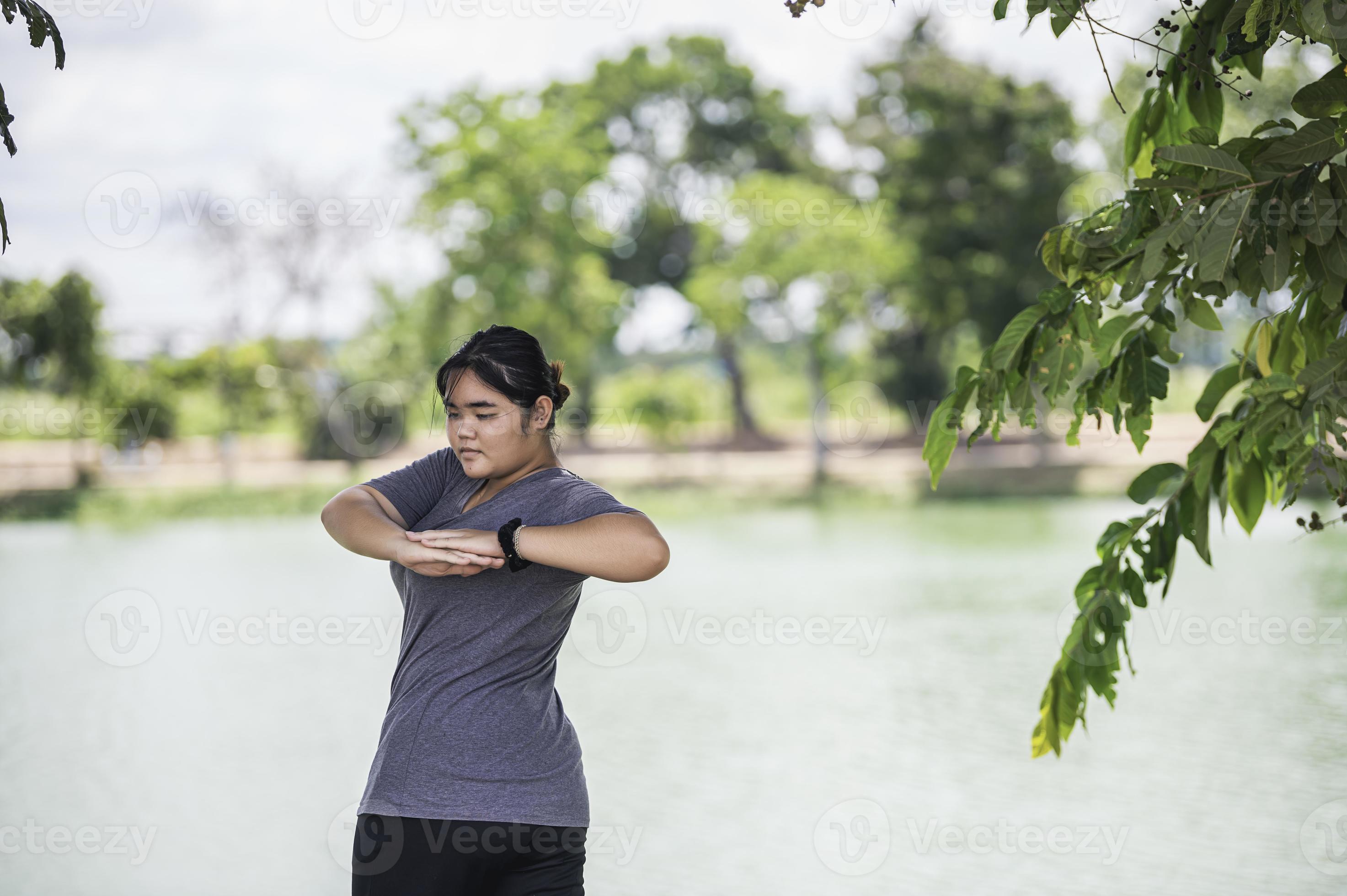 Beautiful asian fat woman play yoga at the park,Need to slim fit body  10452719 Stock Photo at Vecteezy