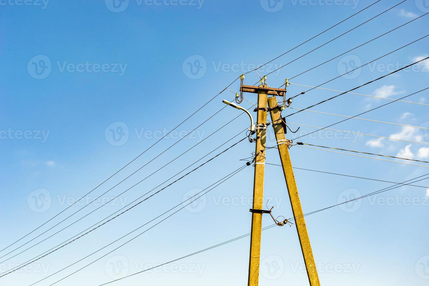 Power electric pole with line wire on colored background close up photo