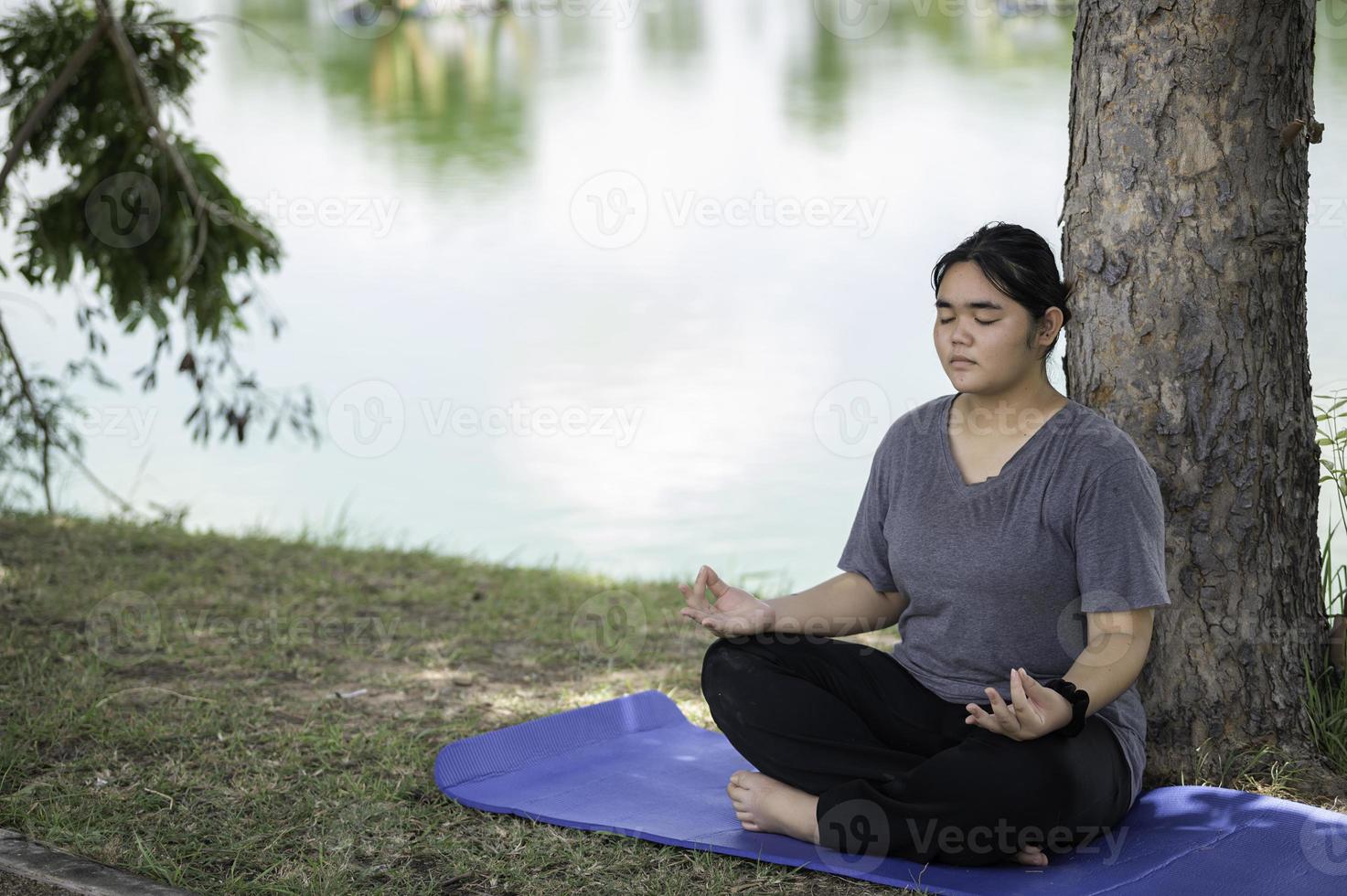 Beautiful asian fat woman play yoga at the park,Need to slim fit body  10452719 Stock Photo at Vecteezy