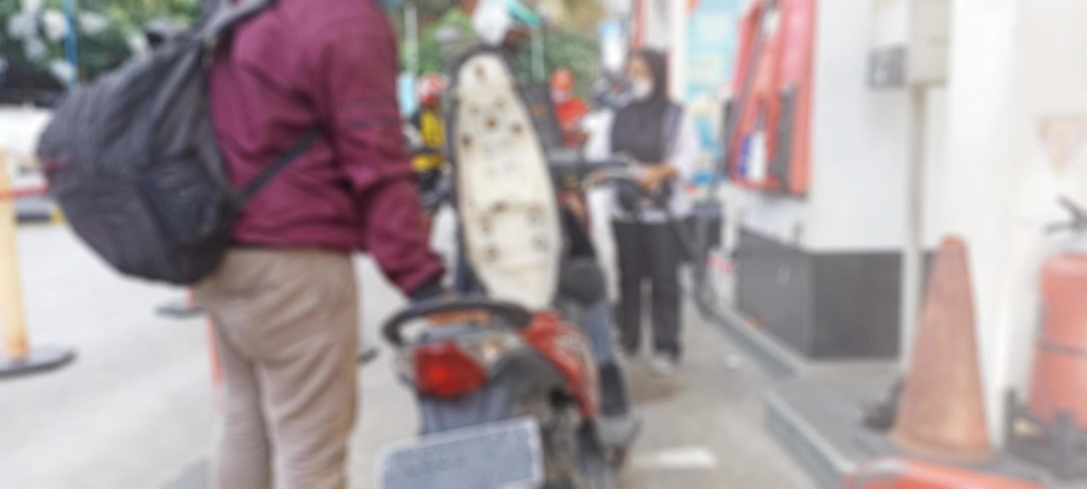 Jakarta, Indonesia. April 2, 2023. The atmosphere of the queue for motorcycles to refuel photo