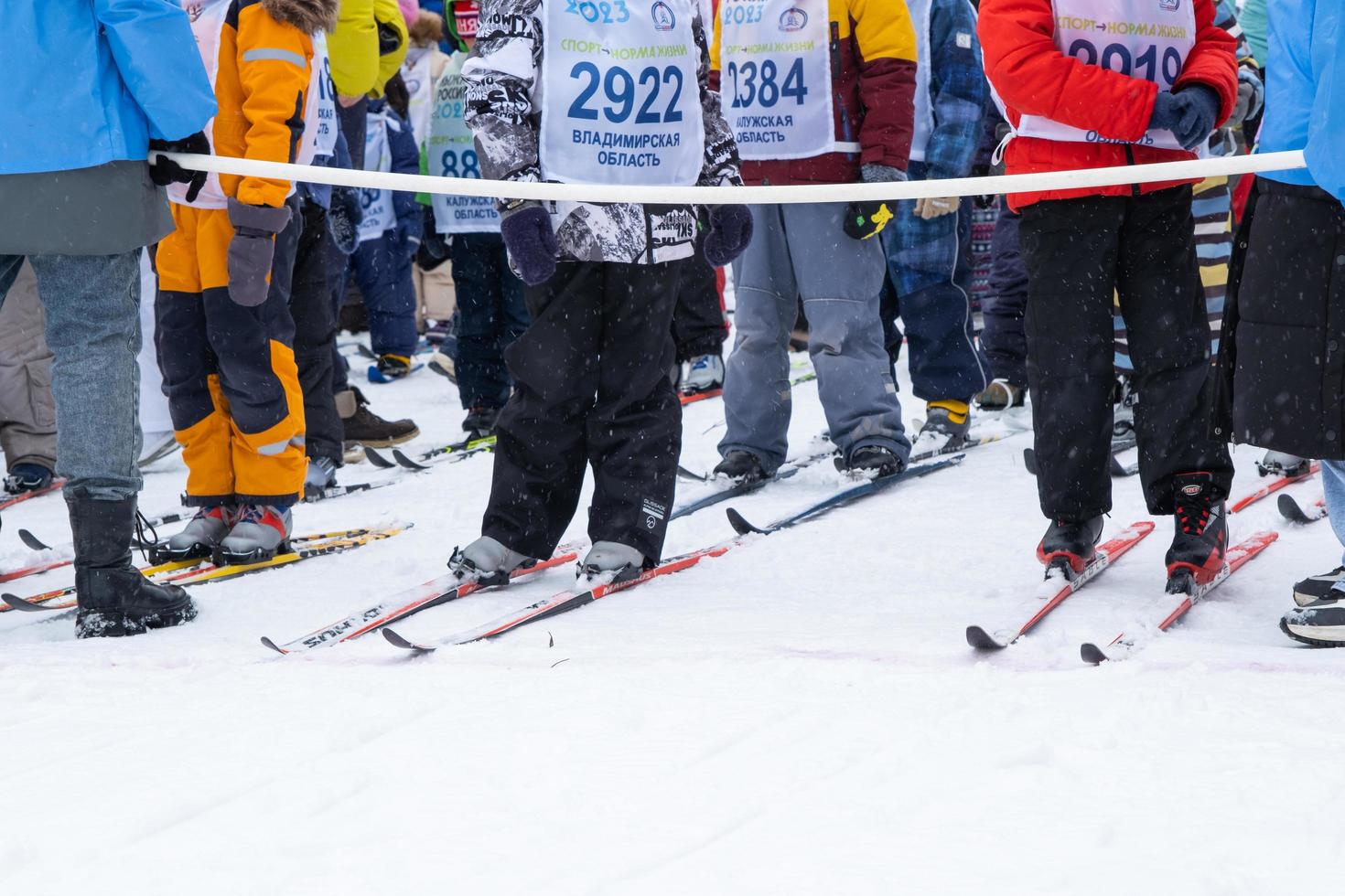 Annual All-Russian sports event action Ski Track of Russia. Sporty lifestyle for adults, children, family holiday on cross-country skiing - mass race on a snowy track. Russia, Kaluga - March 4, 2023 photo