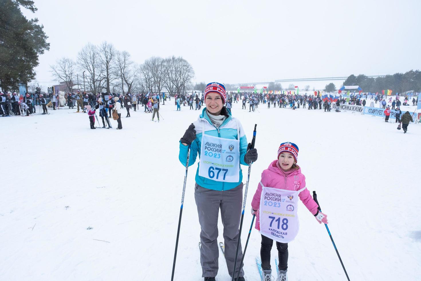 Annual All-Russian sports event action Ski Track of Russia. Sporty lifestyle for adults, children, family holiday on cross-country skiing - mass race on a snowy track. Russia, Kaluga - March 4, 2023 photo