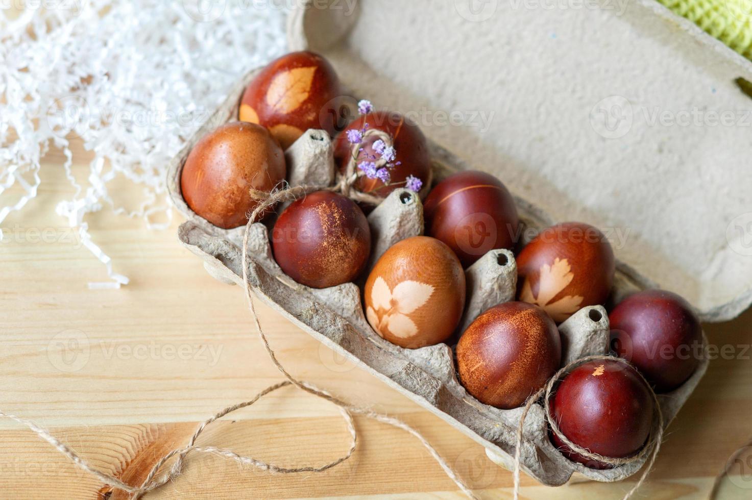 Painted eggs prepared for Easter in a tray photo