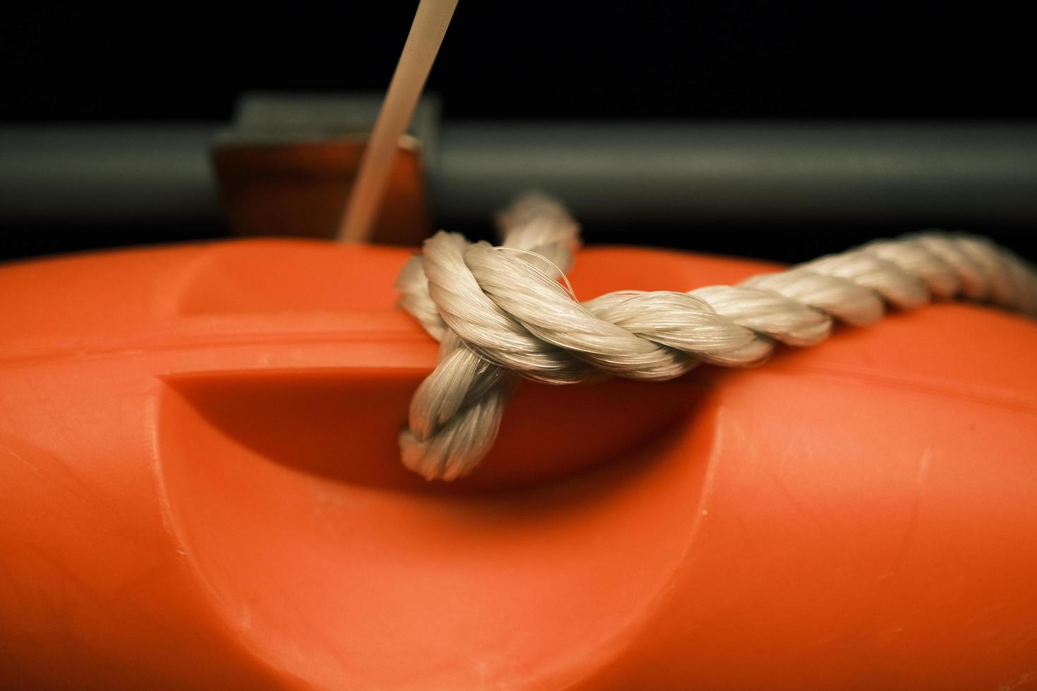 Orange survival ring with hemp rope photo