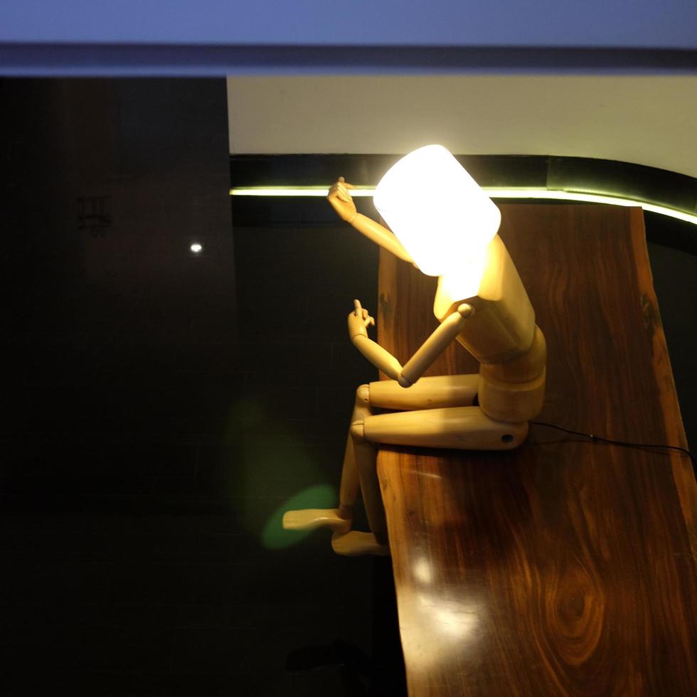 Illuminated humanoid table lamp artwork photo