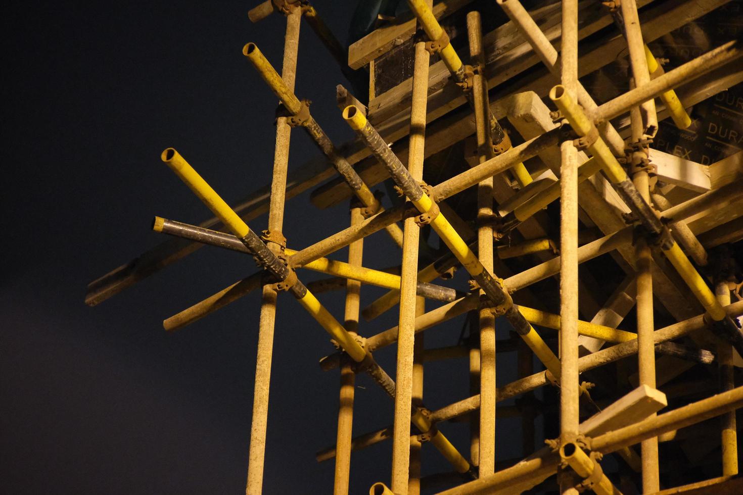 Yellow-black scaffold on the construction site photo