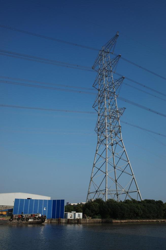 Towers and cables under blue sky photo