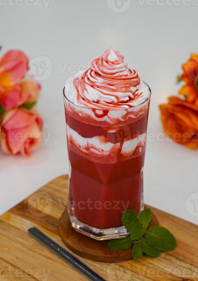 Red velvet Frappe blended with ice and milk with topping whipped cream on top photo