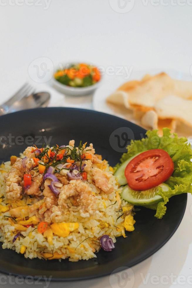 Fried rice sambal matah with crackers serving photo