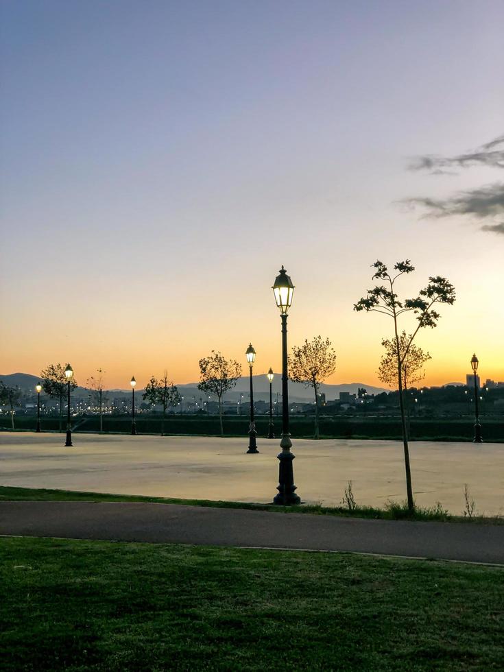 Idyllic and serene sunset vista with a breathtaking panoramic view, capturing the beauty and peacefulness of the sunset in a magnificent display of light and hues photo