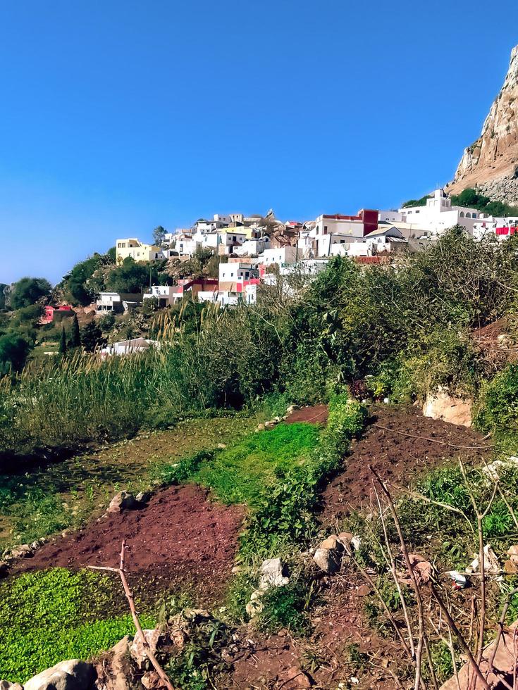 Explore the quaint and charming beauty of a small village on the edge of a mountain, a journey into the heart of natural serenity and simplicity photo