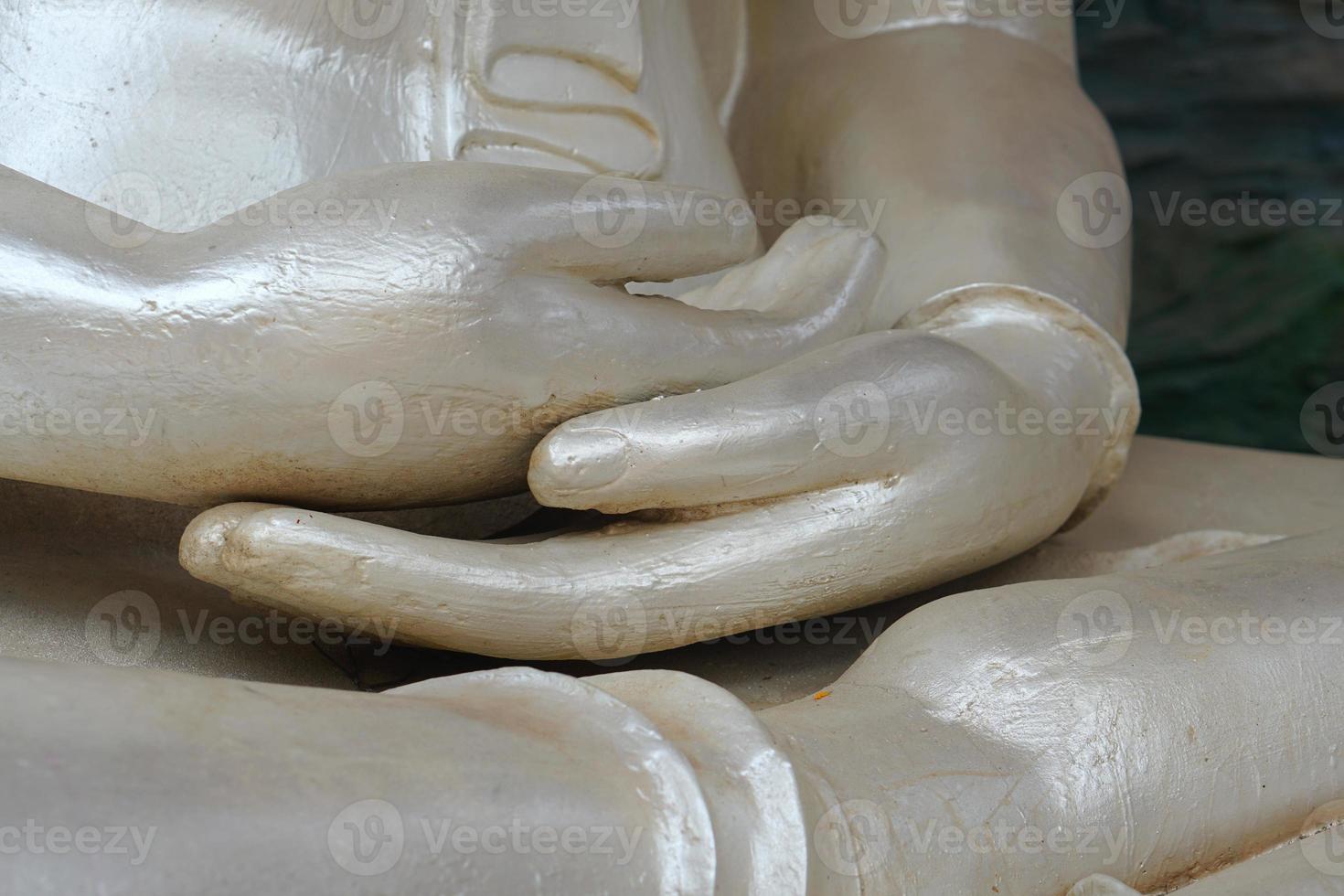 white buddha hand in temple photo