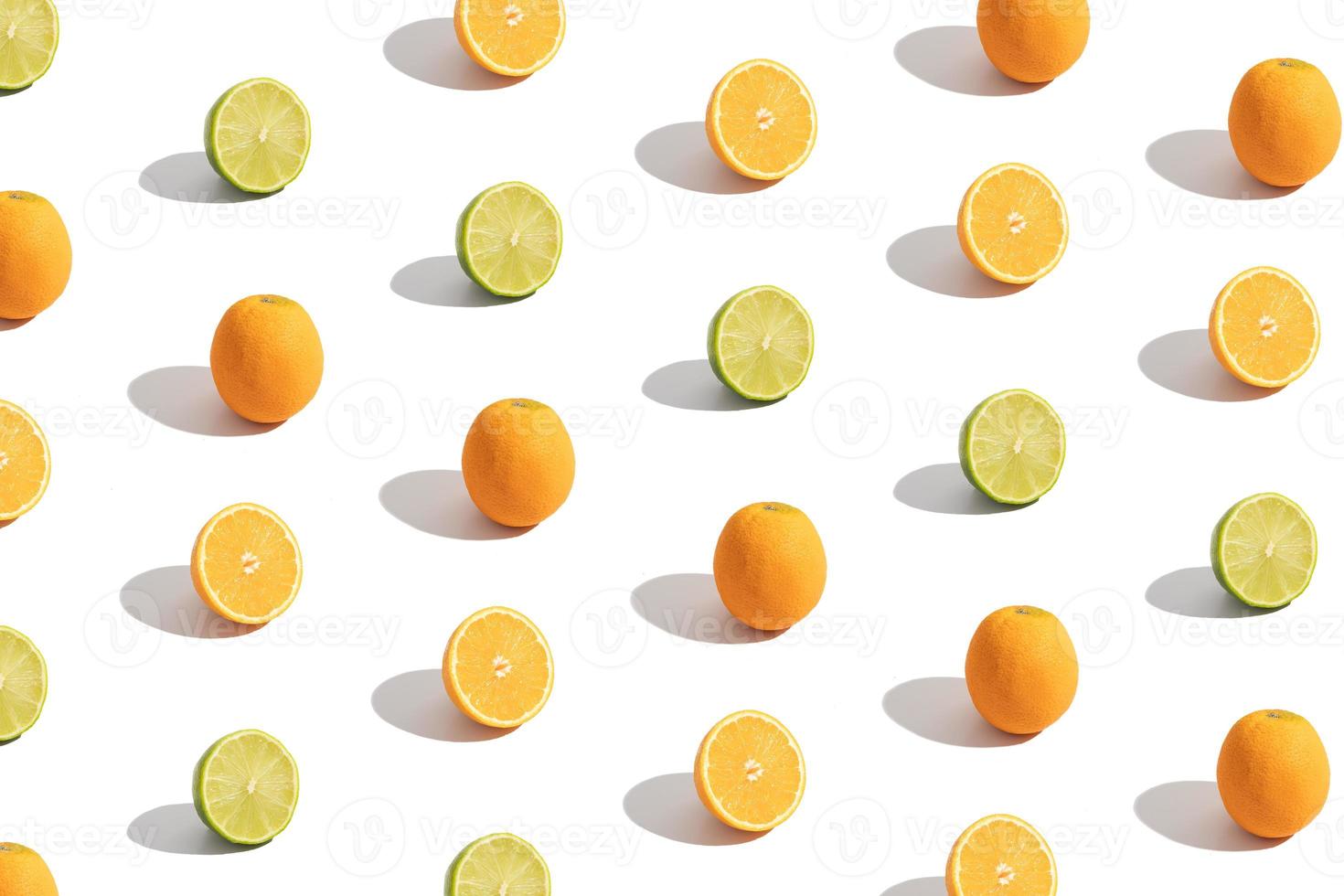 Pattern with citrus sliced orange and lime isolated on white. Abstract summer background photo