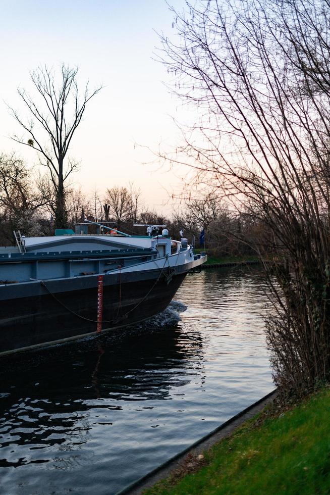 Boat on the Neckar in Heidelberg, Germany, during sunset photo